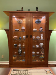 Custom two door inlaid cherry china display cabinet with adjustable glass shelves and remote light controls.